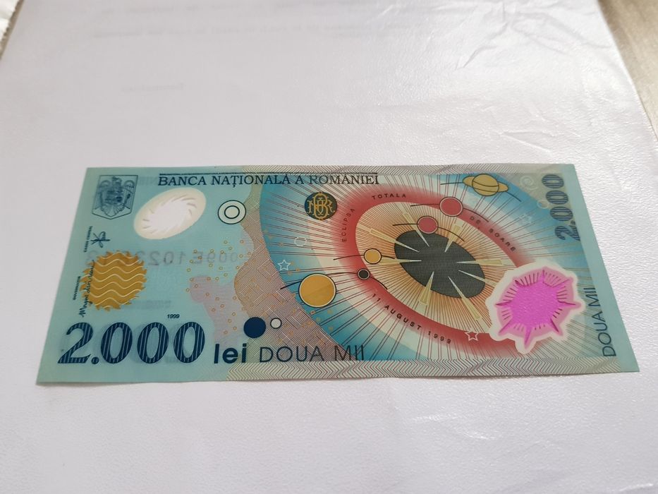 Bancnota 2000 lei eclipsa de soare și moneda 500 lei