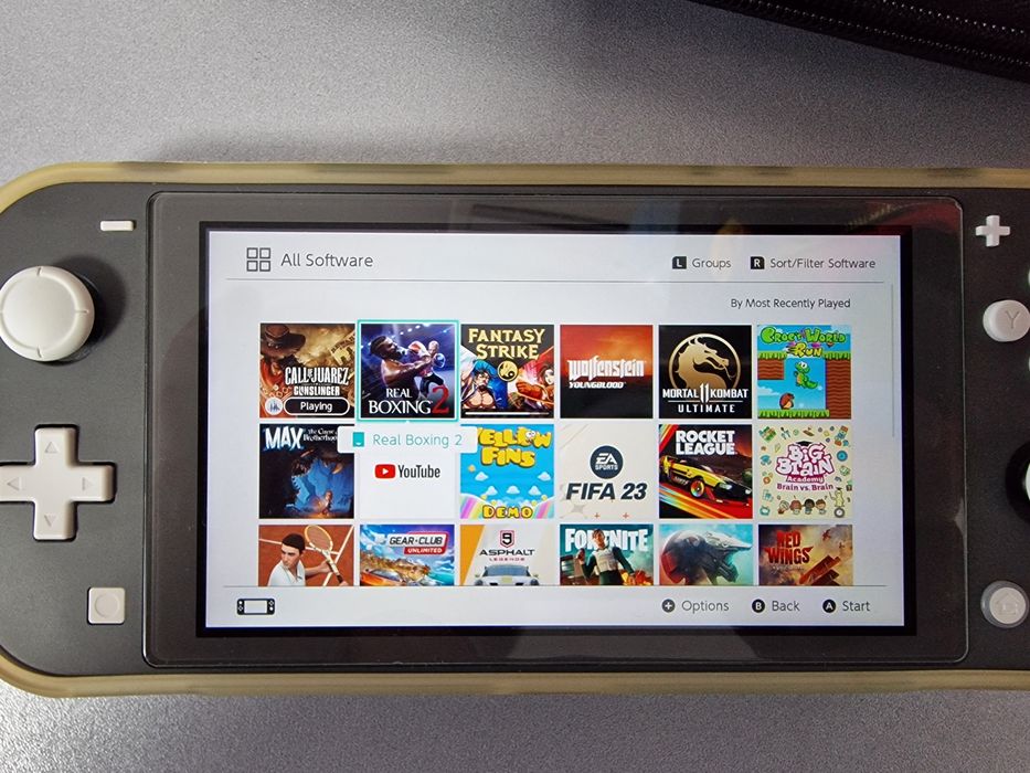 Nintendo Switch Lite + peste 20 de jocuri