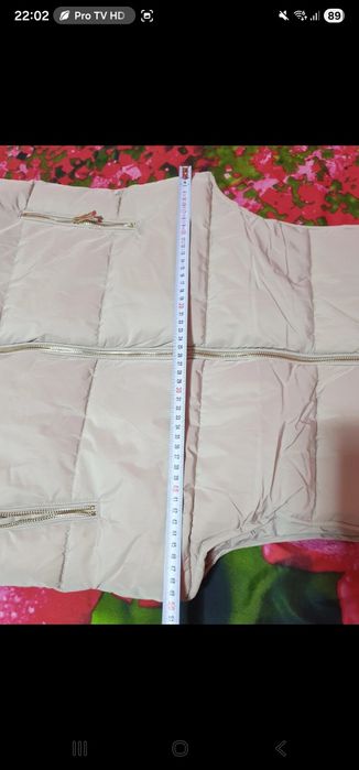 Vesta lunga cu gluga