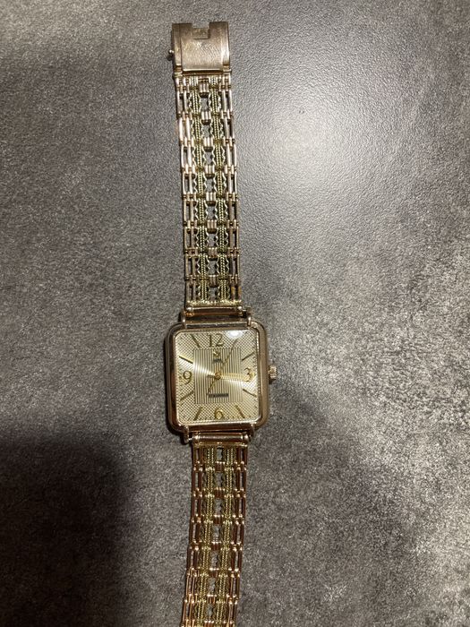 часы золотые ника