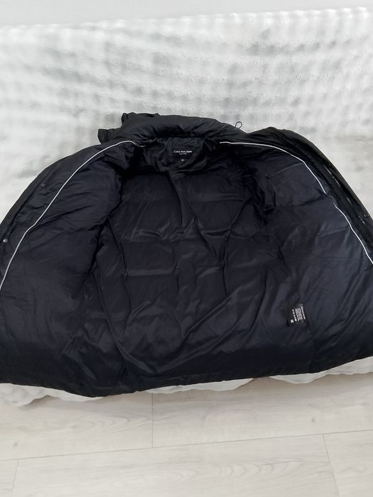 Продам пуховик, размер на 58.