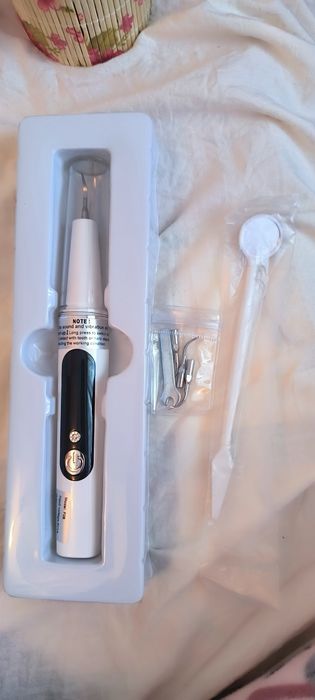 Уред за ултразвуково почистване на зъби