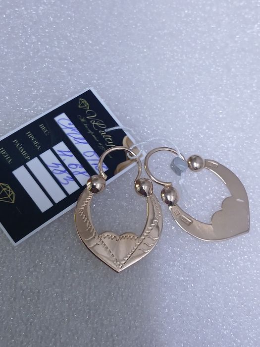 Продам золотые серьги