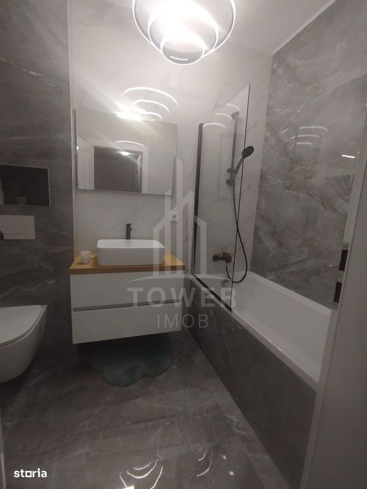 Apartament modern de închiriat, cu balcon și loc de parcare