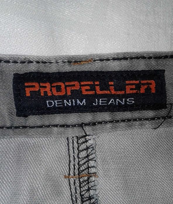 Джинсы Бело-серые. 48 размер