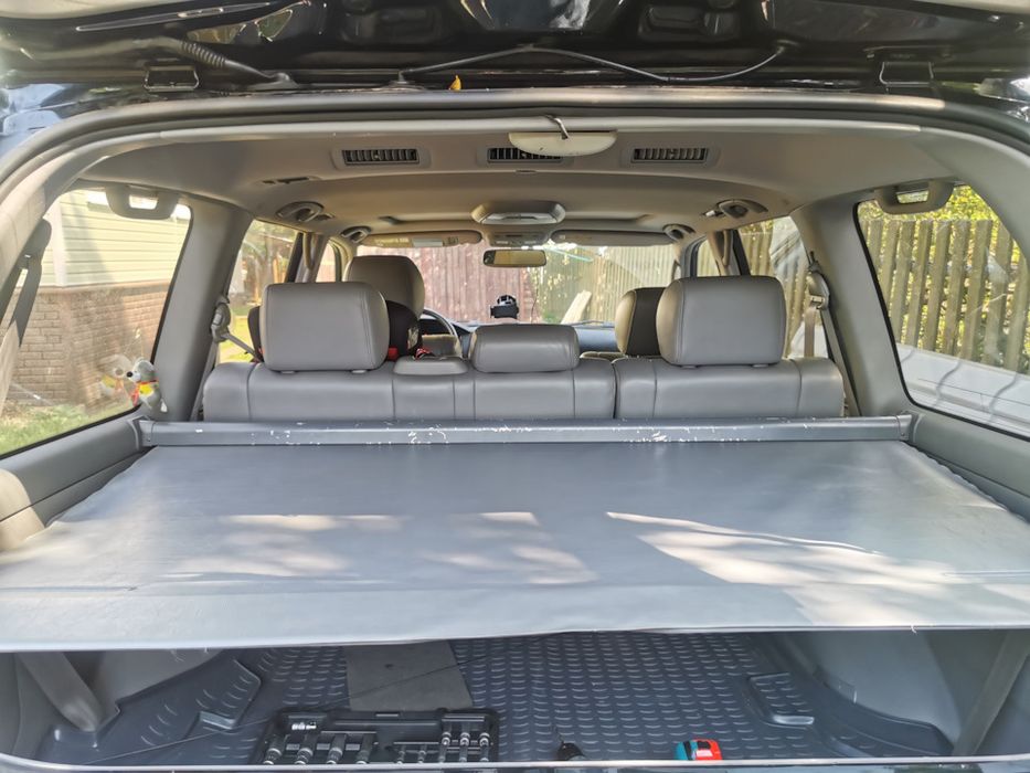 Фото для примера !!!Шторка полка багажника land cruiser 100