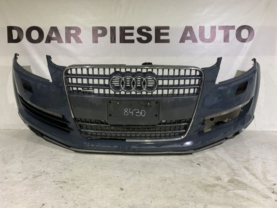 Bara fata Audi Q7, 2006, 2007, 2008, 2009, 2010, cod origine OE 4L0807437, cu gauri pentru spalatori faruri. Bara este noua, spoilerul atins si grila