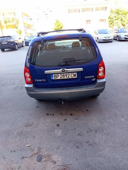 Кола Mazda Tribute