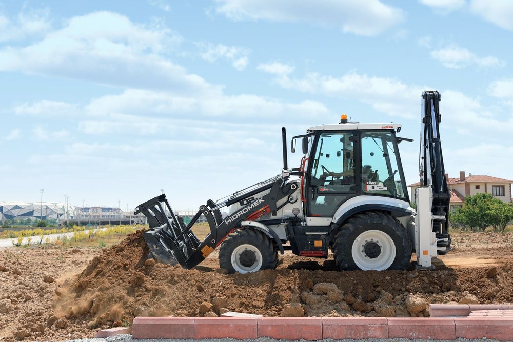 Услуги экскаватора-погрузчика