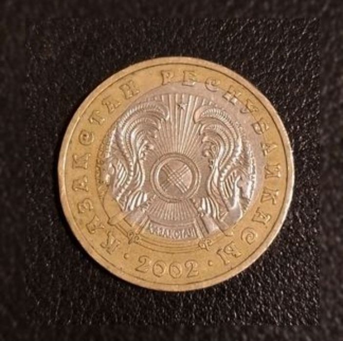 Продам монету 100тг 2002г