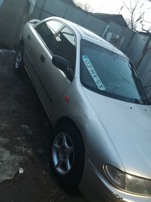 Продам машину Мазда s323