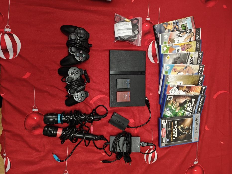 Mega Pachet Consolă Sony PlayStation 2 (PS2 Slim) + 2 Controllere + Microfoane + 8 Jocuri