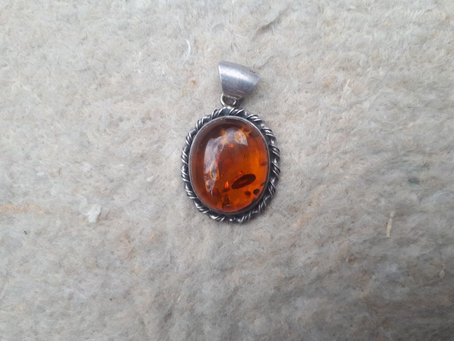 Серебряный кулон.