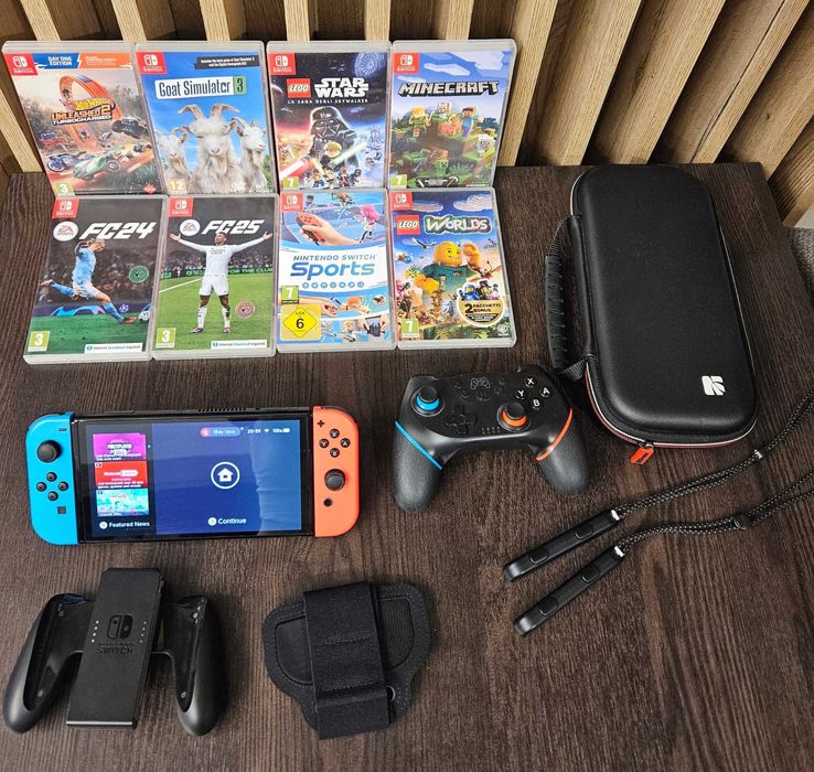 Nintendo Switch OLED + 8 jocuri + controller suplimentar + geantă transport