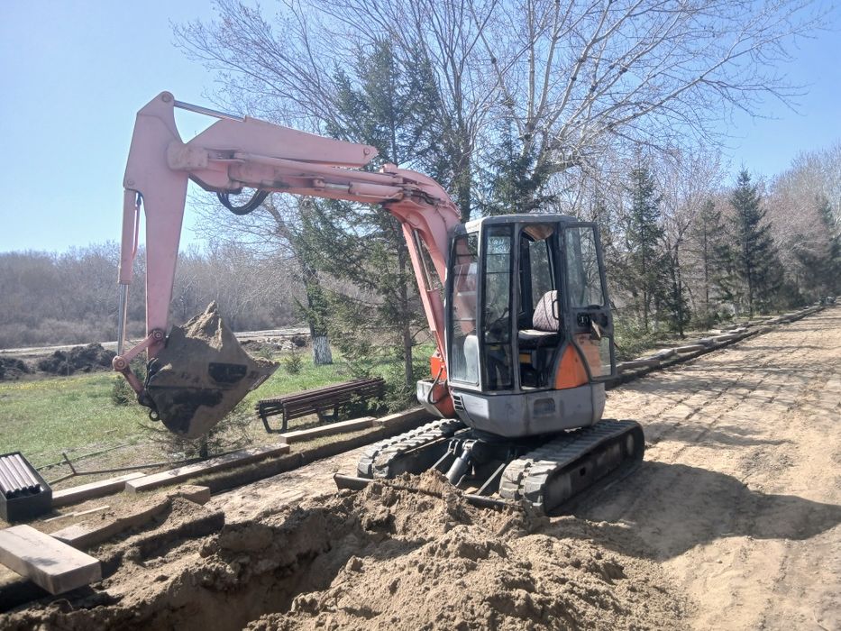 Услуги мини экскаватора ,Мультик ,водопровод ,кабель ,мини трактор