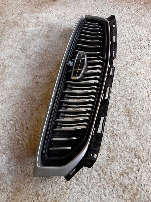 Решотка Geely Emgrand