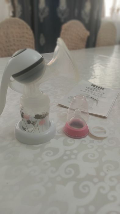 Молокоотсос фирма NUK