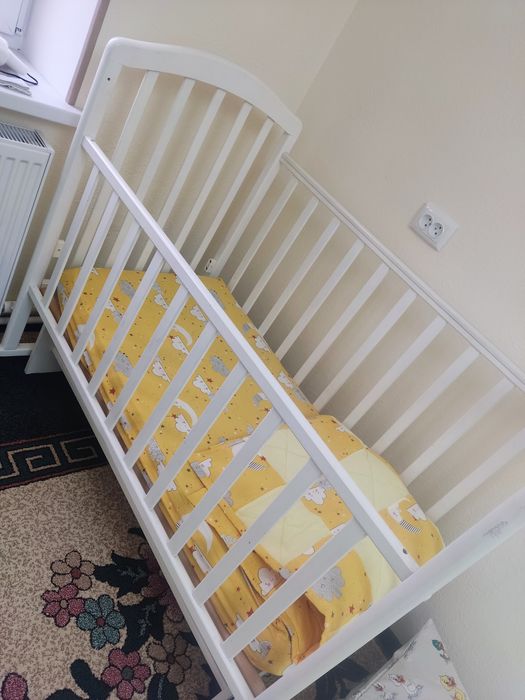 Детская кроватка с маятником Российская