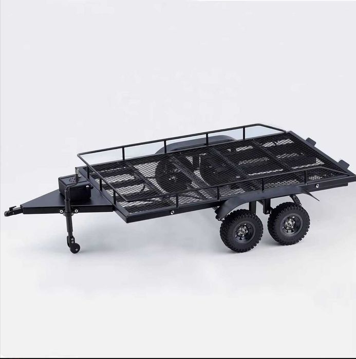 RC. Металлический прицеп с четырьмя
шинами для 1/10RC Crawler.