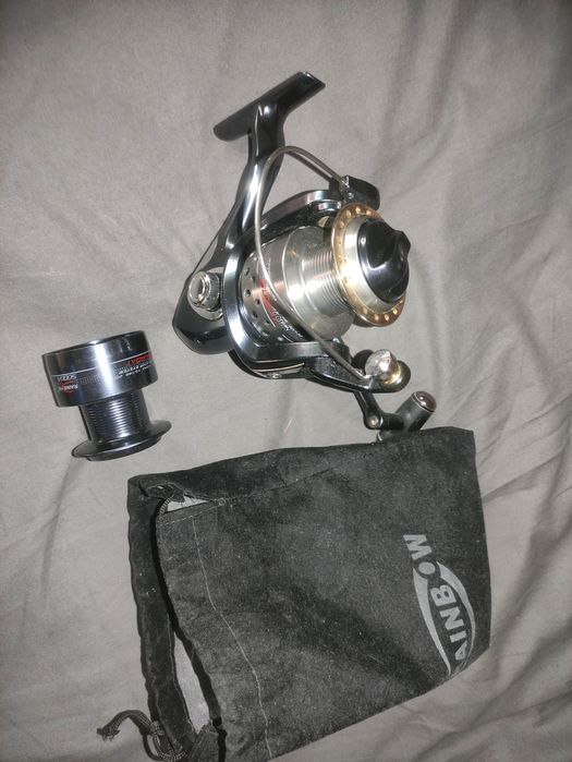 Mulineta pescuit cu 7 rulmenti ca noua cu tambur de rezerva