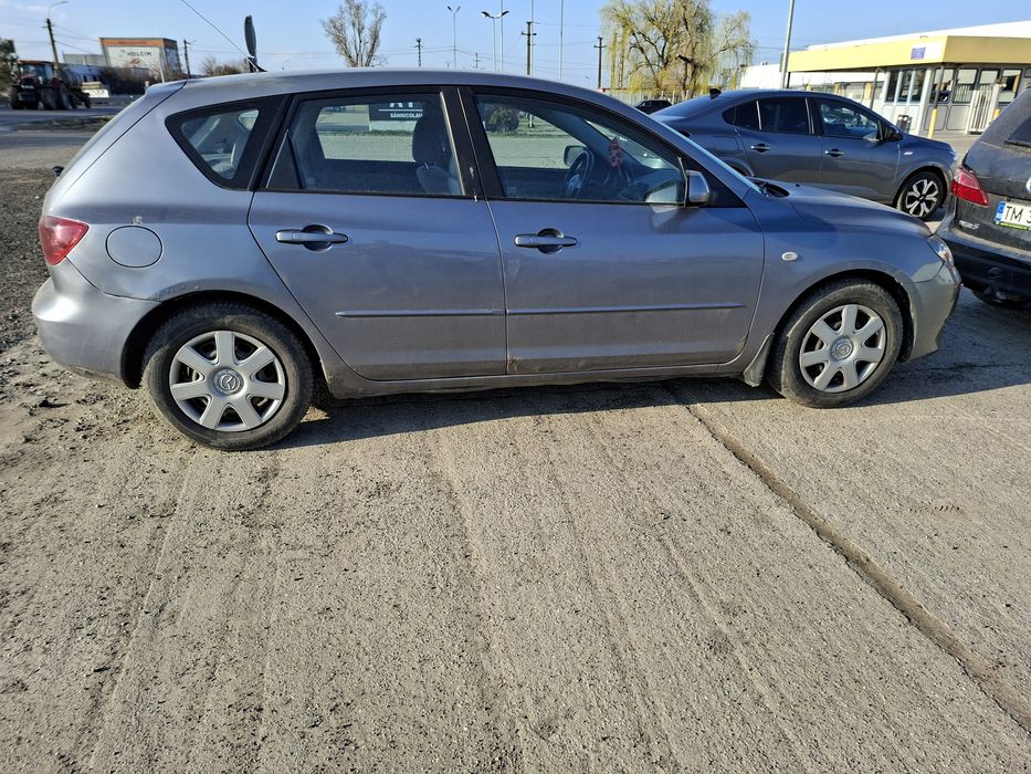 Mazda 3 , 1.4 Benzina , an2004 , 84cai