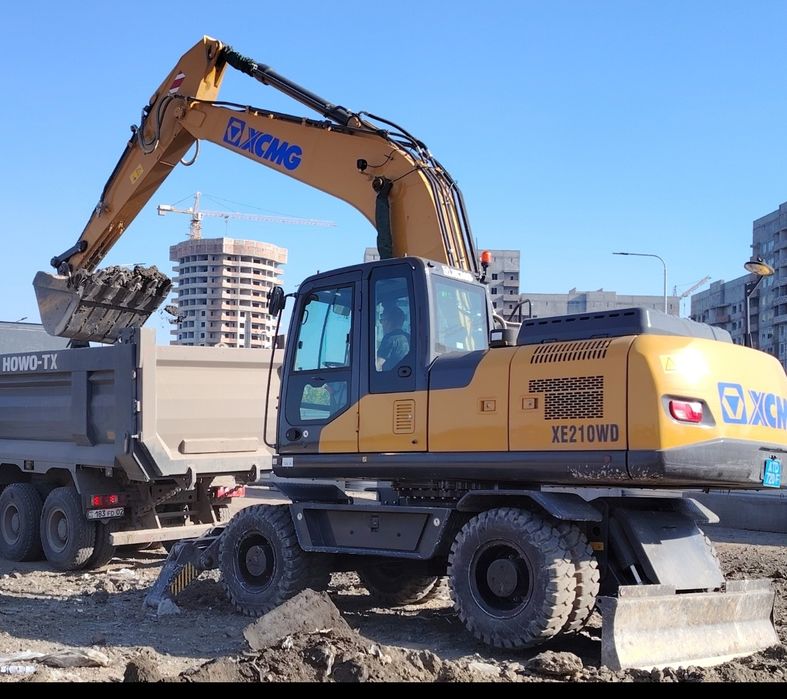 Услуги колёсного полноповоротного экскаватора