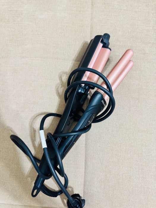 Щипцы для волос Rowenta.