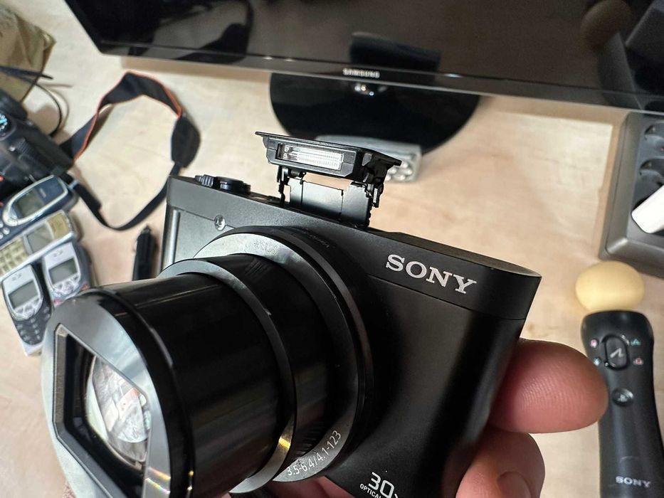 sony dsc-wx500 de culoare negru mat fata spate lateral unghi deschis