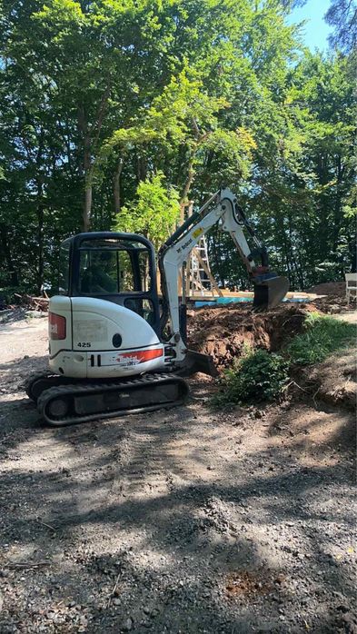 Услуги с багер,самосвал,валяк,изграждане септични ями