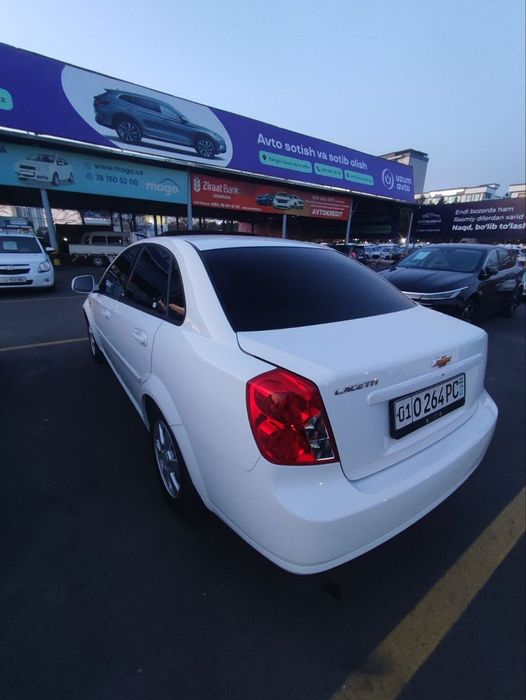 2023 Gentra Lasetti avtomat lyukli oq kraska toza