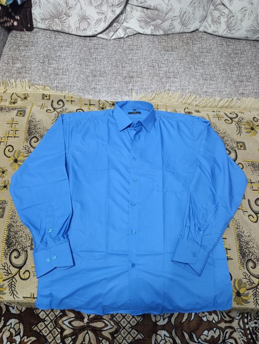 Продам новые брюки ,рубашки,костюм