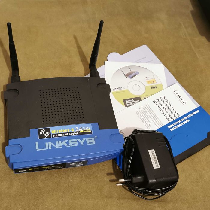 Router TP-LINK Wireless si Router Linksys WRT54GL