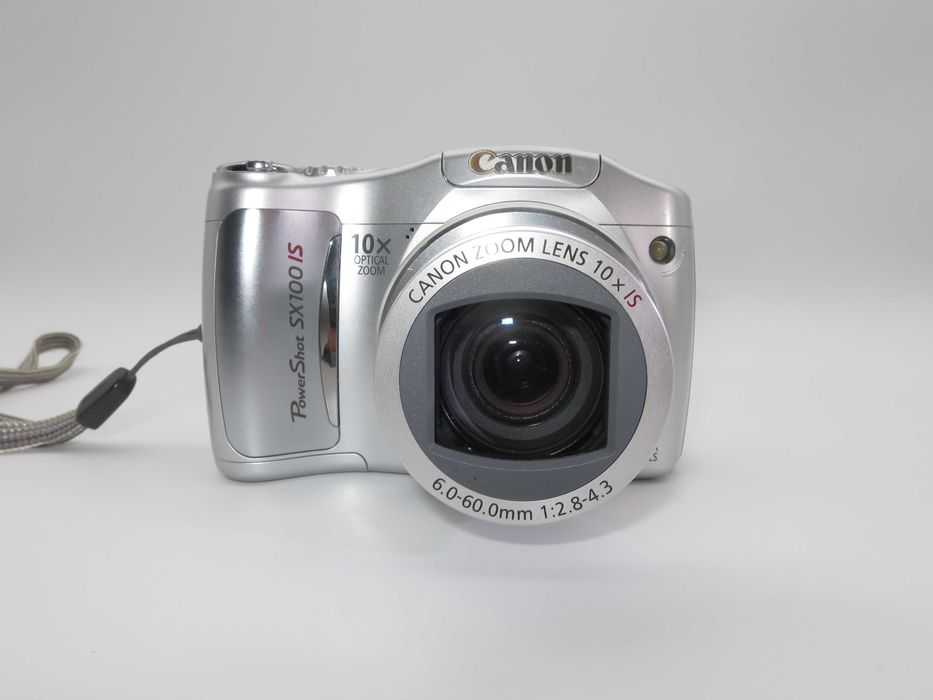 Canon PowerShot SX100 компактен цифров фотоапарат в сребърен цвят, дигитална камера в отлично състояние, 10х оптичен зум, 8MP, тестван работи супер
