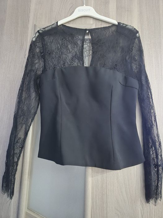 Top damă mărimea M.Pret 60roni