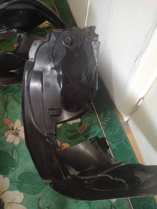 Renault Duster  передние подкрылники.