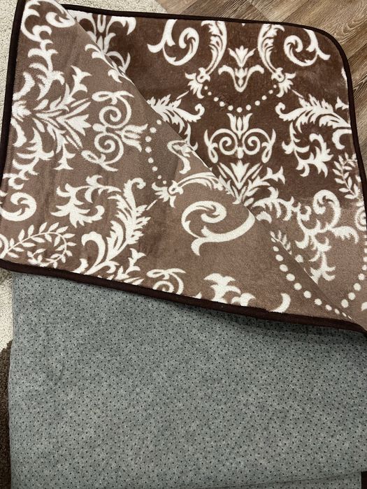 Универсальный коврик размером 191х135.