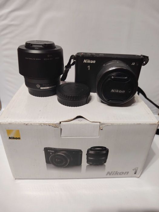 Nikon 1 j 2 с двумя объективами.