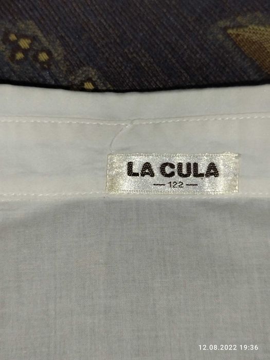 Белая рубашка, на рост 122 см.