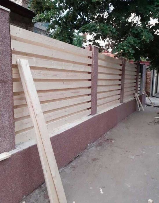 Meseriași la garduri