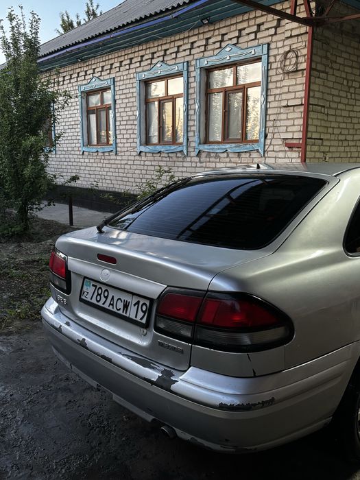 Мазда 626 птичка
