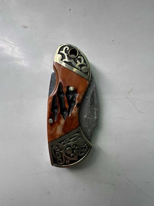 Damashq po'latidan yasalgan yig'ma pichoq