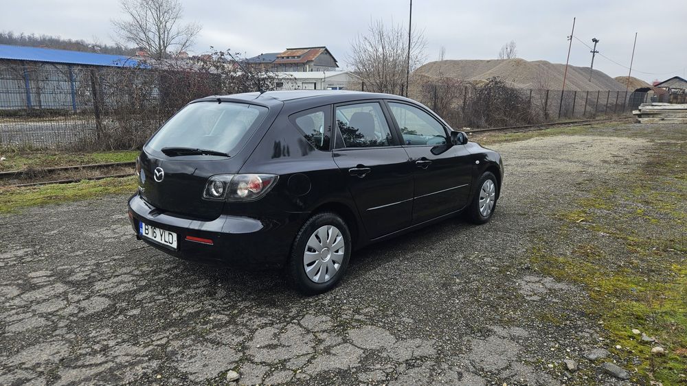 Mazda 3  an 2008 1.3 benzina