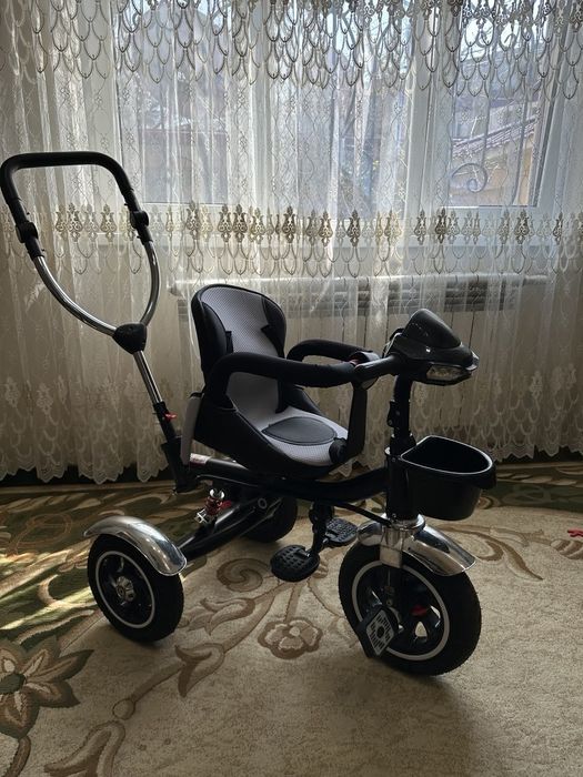 Детский велосипед и велоколяска