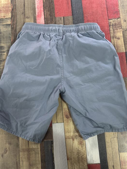 Червени и сиви памучни къси панталони Kiabi за 12-годишни.