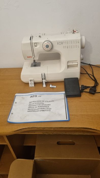 Mașină de cusut electromecanică AEG NM 376S – 26 Programe, accesorii complete, cutie