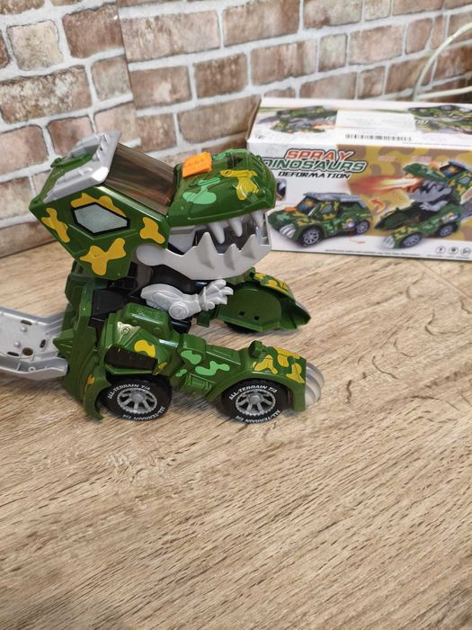 Jucărie dinozaur transformabilă cu lumini,muzică si ,,fum''