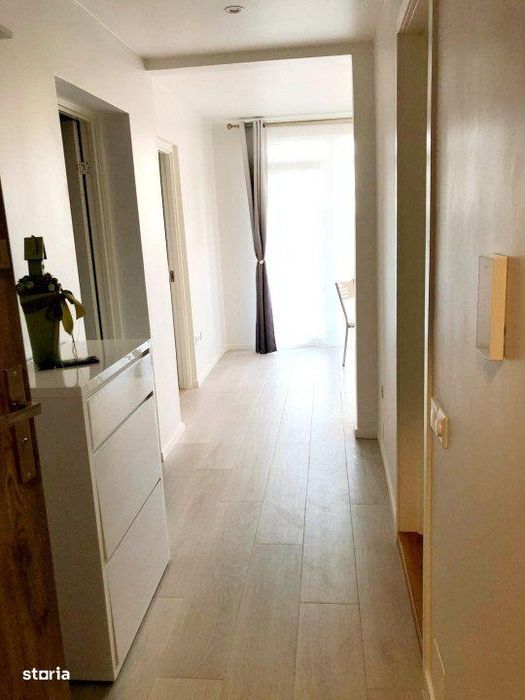 Apartament cu 2 dormitoare, gradina, bucatarie cu dining parcare, zona