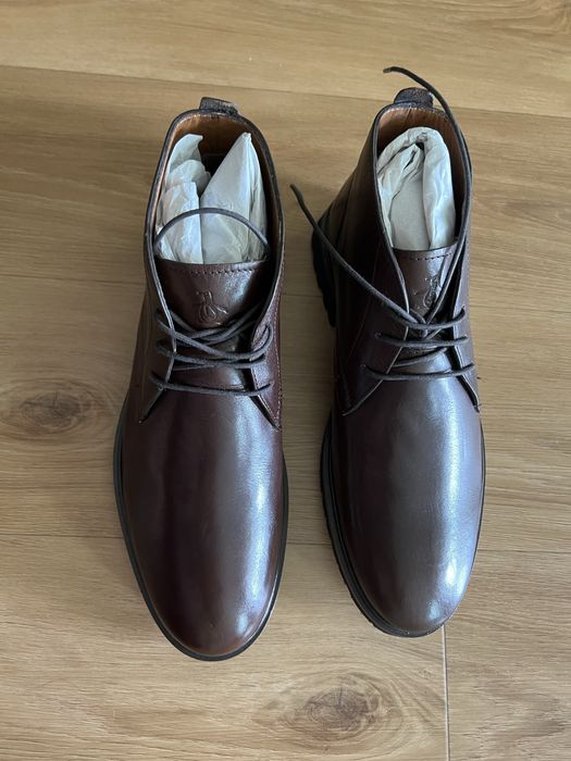 Новые кожаные ботинки