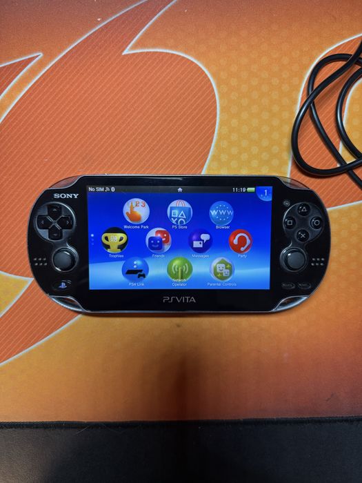 Ps Vita 1104 OLED 16GB, 7 игри, калъф, зарядно и адаптер за карта памет