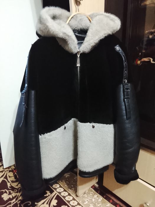 Продам дубленку чёрна- серая.